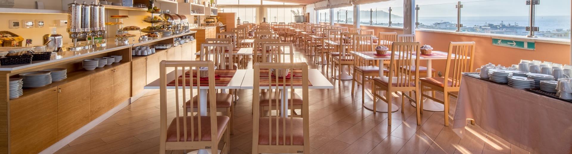 The breakfast room of the hotel with sea view