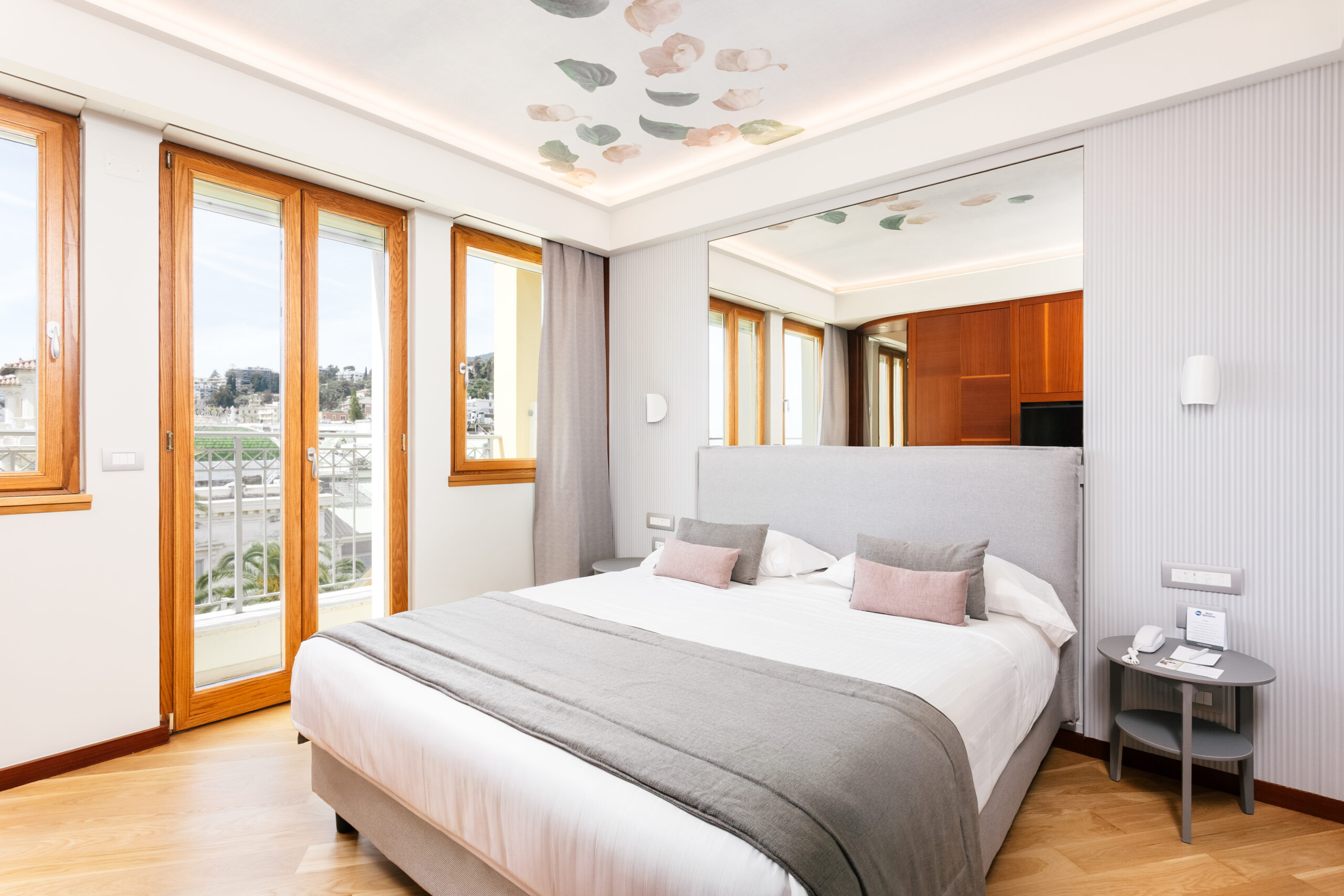 The image shows a room with a window and a double bed.